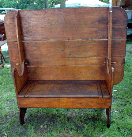 David Beauchamp, Brookline, N.H., brought this pine hutch table, circa 1730, shown here with the top tilted back to reveal a lift top seat.