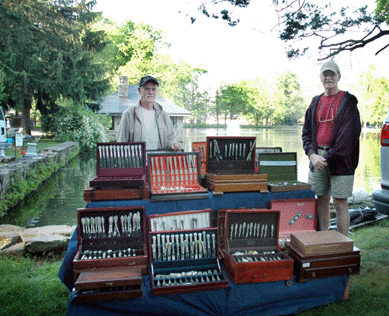 Bill Scott and David Chita from Danielson, Conn., were set up near the pond with their collection of American matching silver services.