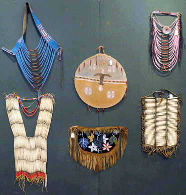 The Cheyenne beaded loop necklace, top left, brought $1,610; the woman's breastplate beneath it $345; the Plains loop necklace, top right, $2,040; the man's breastplate beneath it $2,040; the Ghost Dance shield, top center, $9,200, and the dance apron beneath it realized $230.