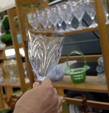 Peter Raleigh of Splendor in the Glass, Harrison, N.Y., holds up a Caprice water goblet by Cambridge, circa 1943‴9. The dealer sold the set of eight at the show.