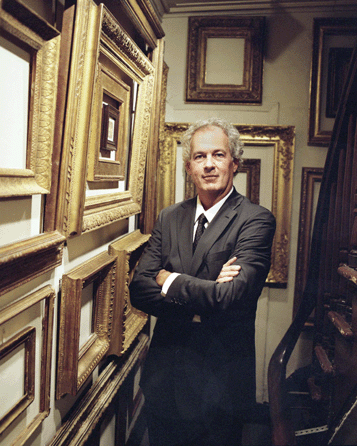 Eli Wilner at home amid the period frames that his company offers.