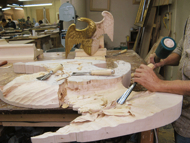 Eli Wilner & Company's master carver, Ecuador-born Feliz Teran, whom Wilner says is the only carver in the country who could carve this frame, works on the reproduction of Leutze's original frame. Teran was responsible for the 12-foot crest; it took him nearly eight months to carve its various components. 