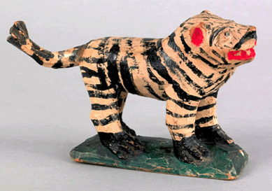 The most popular carving by Wilhelm Schimmel was this figure of a painted tiger, retaining a black and white striped surface atop a green base, 4¼ inches high, 7¼ inches wide, which sold for $81,900, just over the $80,000 high estimate.