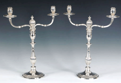 Top lot among the offering of silver was this pair of Georgian two-light candelabra, circa 1776‱777, bearing the touch of Jones and Schofield, each with a reeded baluster shaft and scrolled flat decorated arms. Measuring 16½ inches high, the pair sold for $39,780 against a high estimate of $7,000.