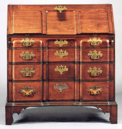 The top lot of the auction was this mahogany blockfront desk, Boston, circa 1760, with shell carved interior. Retaining its original brasses and with an old refinish, the bracket base desk sold at $71,100.