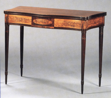 One of a pair of Federal mahogany and wavy birch inlaid card tables, North Shore, Mass., that sold well above estimate at $23,700.
