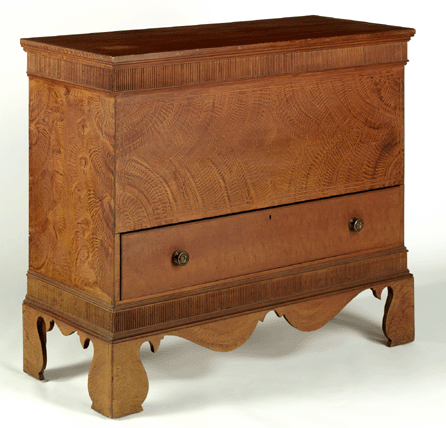 Brock Jobe and Jack O'Brien describe the pine chest from Easton on the Outer Cape as ranking "among the very best examples of Nineteenth Century New England painted furniture.†It has a beautifully painted surface and an extravagant bracket base and its condition is "pristine.• style=