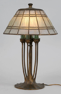 A Tiffany linen-fold shade with a six-light bronze base that went to the phone for $17,700.
