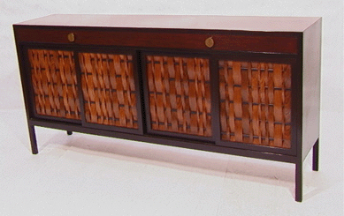 An Edward Wormley for Dunbar sideboard and buffet cabinet in rosewood and mahogany, featuring four rosewood woven doors and three drawers and raised on legs, went to $3,450.
