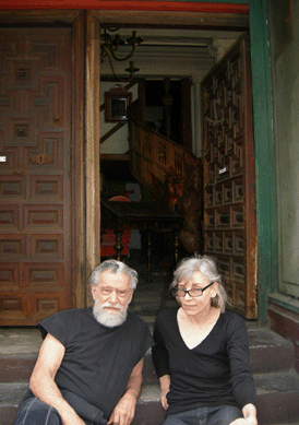 Maurice Margules and Antonie Reinhard, partners in the business for ten years, on the steps of Metro Antiques.