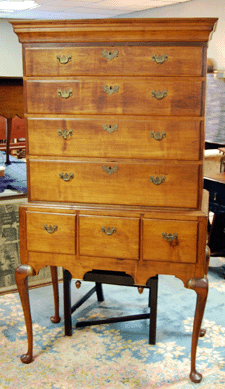 An Eighteenth Century Connecticut Queen Anne cherry highboy sold to an absentee bidder for $3,584.