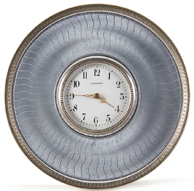 A petite Fabergé guilloche enamel clock, measuring 3½ inches in diameter, sold for $72,000.