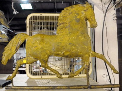 A Black Hawk weathervane in a mustard finish sold at $2,530.