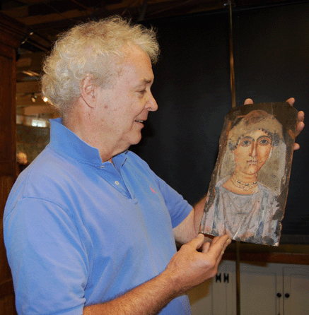 Dealer Keith Funston of Sudbury, Mass., admires the Fayum sarcophagus portrait that went for $143,750.