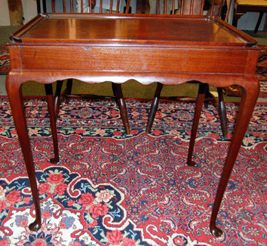 The New England Queen Anne mahogany tray top tea table elicited $18,975.