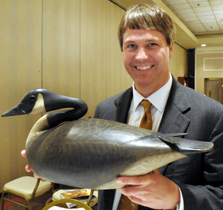 Copley's Steve O'Brien with the Elmer Crowell Canada goose from the Harry Long collection that sold for $661,250.