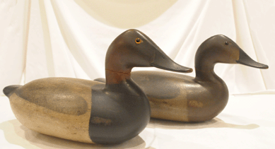 The pair of John "Daddy†Holly canvasbacks hammered down at $155,250.