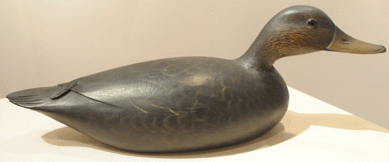 The swimming black duck from the Harry Long collection by Elmer Crowell sold for $115,000, going to the same buyer that purchased the preening pintail.