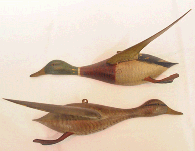 A pair of half-sized wall mount flying decoys by Chauncey Wheeler that had descended in the carver's family brought $37,950.