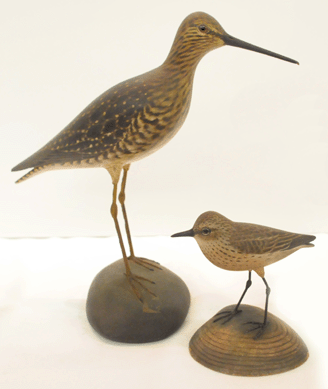 Elmer Crowell decorative carvings did well with a greater yellowlegs, left, selling at $28,750, while a bluebird brought $3,737. 