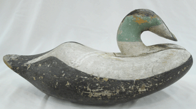 A "finely sculpted†eider drake by an unknown maker from Deer Isle hammered down at $46,575.