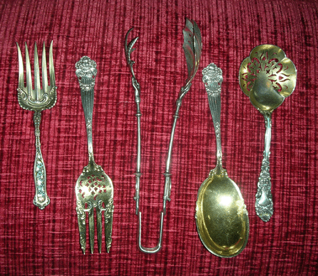 The most rare item stolen is shown in the center of this group (the other items were not taken) †a pair of very rare Gorham large sterling ice or chicken tongs in the Lady's pattern, circa 1860, different single monogram in old English initial on each disc. 