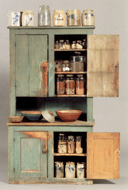 The blue-green painted step back cupboard realized $2,370, a small light blue wooden bowl brought $3,437, a larger bowl in blue was $3,318, and a bowl in red realized $1,067 (Whittemore collection).