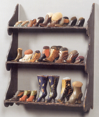 Collections within Sally's collection also rewarded buyers, such as her group of 28 delightful miniature shoe-form pin cushions that sold for $5,629. The painted wall shelf with boldly scrolled sides made $7,703. 