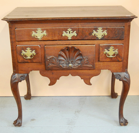 Philadelphia or Maryland? The Chippendale carved walnut lowboy has design elements common to both areas. It realized $58,500. 
