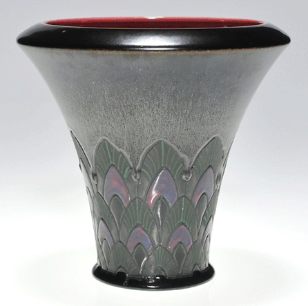 The top lot of the auction was a rare Rookwood French Red vase, exhibited at the Cincinnati Art Museum, that attained $14,375.
