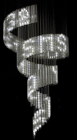 "Lolita,†2004, demonstrates Arad's use of high and low technologies in an object that is shaped like a flat ribbon wound into a corkscrew shape. It utilizes 2,100 crystals and 1,050 white LEDs and can display messages sent to "Lolita's†mobile number. Edition by Swarovski. Photo courtesy of Ron Arad Associates, London.