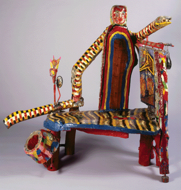 This strange-looking object, made of mixed media on painted, salvaged wood and measuring 53 by 60 by 29 inches, was made by Willie LeRoy Elliot of Detroit. Functional as well as sculptural, "The Last Frontier,†circa 1988‱989, can serve as a love seat, side table and tray with primping mirror all at once.