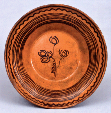 The slipware bowl attributed to Peter Bell, Hagerstown, Md., made $18,400.