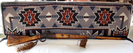 An Indian rifle owned and decorated with thunderbird images by White Man Runs Him, the scout for General George A. Custer at the Battle of Little Big Horn, sold for $21,850.