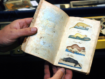 James E. Arsenault, Arrowsic, Maine, shows a handmade American bestiary, a book of animals in watercolor, dated on end paper, 1787. 