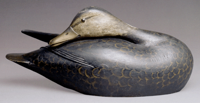 Combining utilitarian purpose with exceptional artistic grace, this painted black duck decoy made around 1903 by A. Elmer Crowell of East Harwich, Mass., for his friend and employer Dr John C. Phillips sold privately on Sunday for $103,500 after passing in the room on Saturday and after its reserve price was lowered. Given to the Massachusetts Historical Society in 1934, the sculpture was on loan for decades to the Peabody Essex Museum, which displayed it beginning in 1989 as part of a Massachusetts waterfowl decoys exhibit. Recently discovered repairs to the wing and lower beak, undertaken around the time of the exhibition, lowered the price on what otherwise could have been a record-setting decoy.