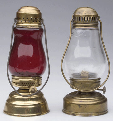 Lot of two brass skater's lanterns realized $1,380.