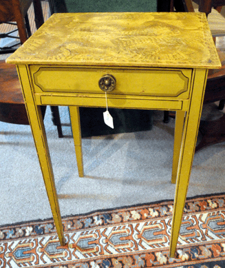 The rare painted Maine stand in yellow with a grain decorated top had attracted the attention of several in the crowd. From a local estate, the stand was estimated at $1,5/1,800, yet sold to a buyer in the room at $17,825.