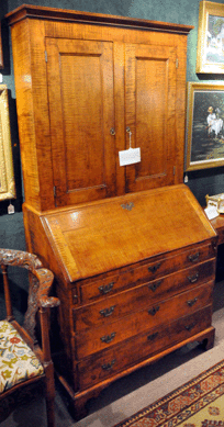 Furniture included the secretary desk in strongly figured tiger maple that hammered down to an absentee bidder for $16,100.