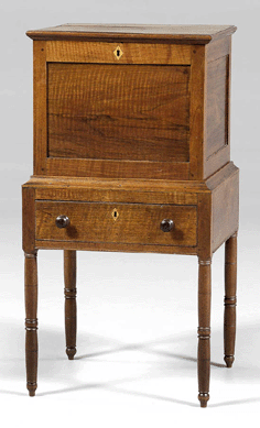 At $12,650, this one-piece walnut and yellow pine cellaret with open interior was the top furniture lot.