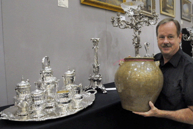 Canton, Ga., dealer Michael Weaver with a rare Edgefield pottery jar made by "Dave the Slave.• style=