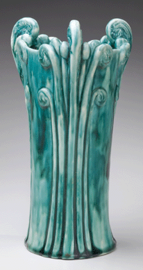 A naturalistic fiddlehead fern slip cast earthenware vase from Tiffany Studios.