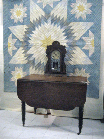 Diana M. Higgins Antiques, Hampton, Conn., showed this quilt and country table.