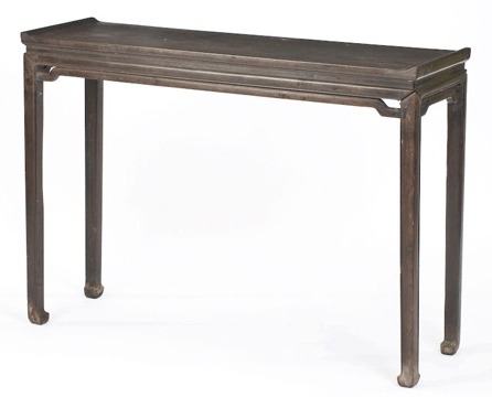 Chinese Qing dynasty zitan rectangular altar table with humpback stretchers below the aprons and four square-form legs with horseshoe-style feet; it sold at $56,762.