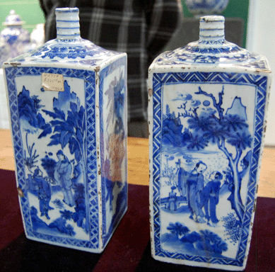 Two 11½-inch blue and white transitional period square bottles that attracted much interest in the preview sold for $122,103.