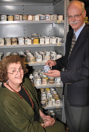 Jane and Richard Nylander, shown with Historic New England's collection of Staffordshire children's mugs.