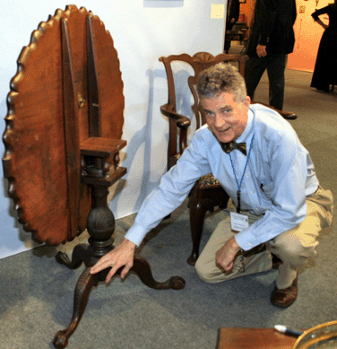 Virginia dealer Sumpter Priddy III showed off a rare Frederick County, Md., piecrust tea table with distinctive pointed lozenge-shaped carvings on its legs and realistically carved talon feet. Walnut throughout, it descended in the Shriver family.