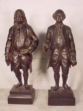 This pair of finely carved wood folk art figures of Ben Franklin and John Adams realized $9,200.