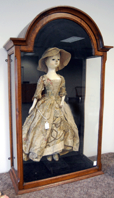 A regal English Queen Anne carved wood doll from about 1720 retained the original brocade gown, petticoats and shoes and realized $50,363.