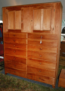 Made by Amos Stewart at Mount Lebanon in 1839, the pine cabinet realized $58,700.